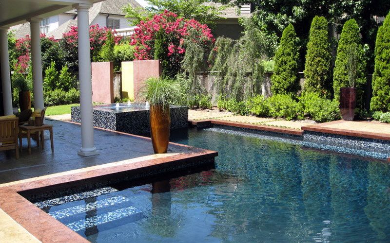 A custom pool with landscaping creates a relaxing environment.