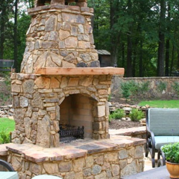 A custom fireplace can make for a cozy outdoor hardscape element.