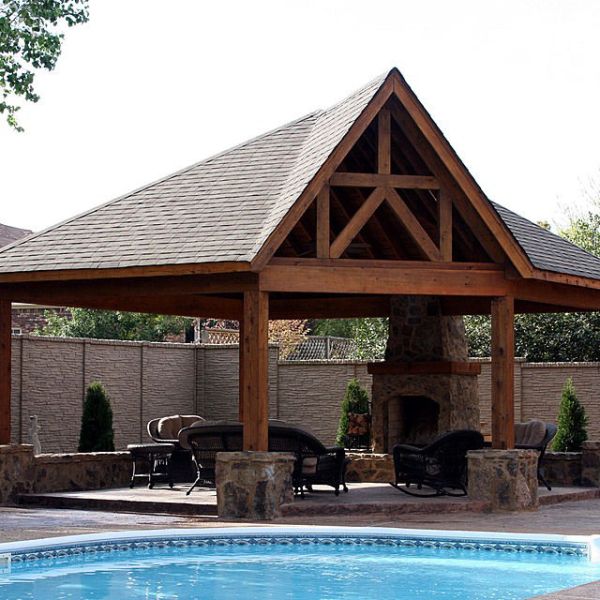 A grand scale outdoor kitchen covered patio.